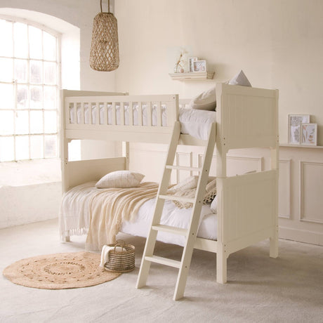 Fargo bunk bed in ivory white by little folks furniture with cream bedding in a cream room